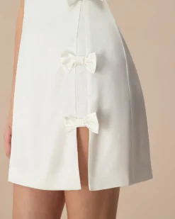 The White Boat Neck Bowknot Satin Mini Dress